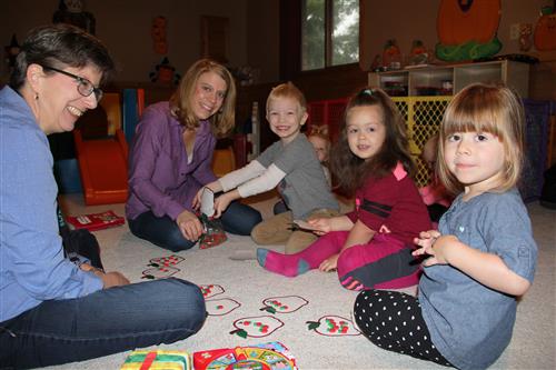 Teachers work with children in child care 